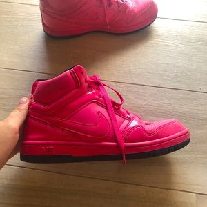 Hot pink Nike high tops